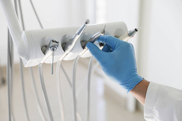 Professional Tooth Extraction technician working in Plandome, NY